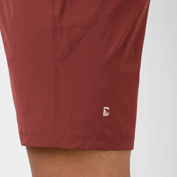 Atlas Short 7" Maroon close up of reflective logo on left leg