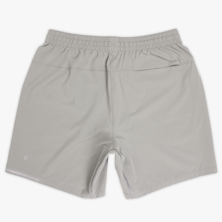 Run Short v2 7" Grey back with elastic waistband, back right hidden zipper pocket, reflective line on bottom left hem, and reflective Bear B logo on bottom left leg