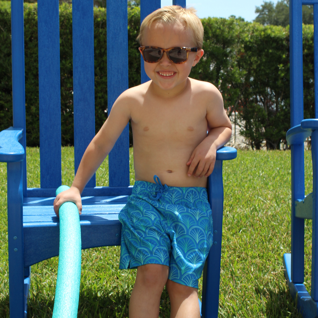 Boys Stretch Swim Scale on model holding pool noodle