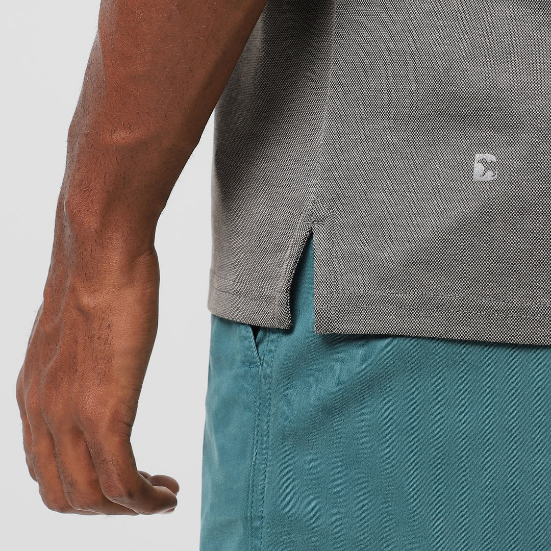 Range Polo Charcoal close up of Bearbottom B logo and split hem