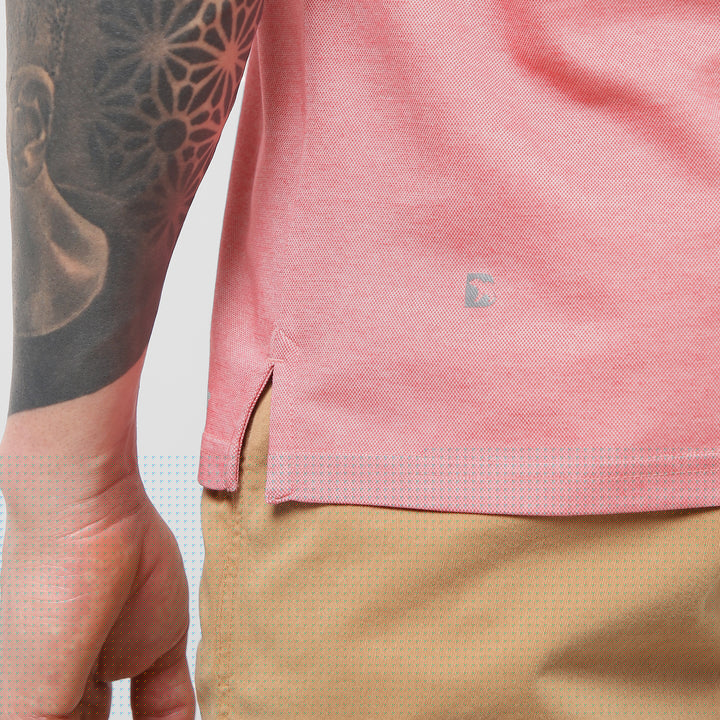 Range Polo Coral close up of Bearbottom B logo and split hem
