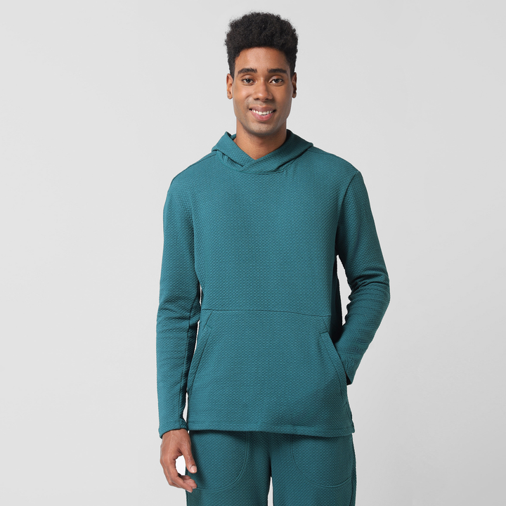 Roam Hoodie Dark Teal front on model