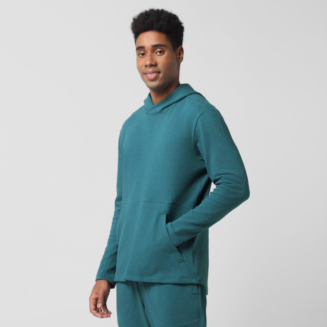 Roam Hoodie Dark Teal left side on model