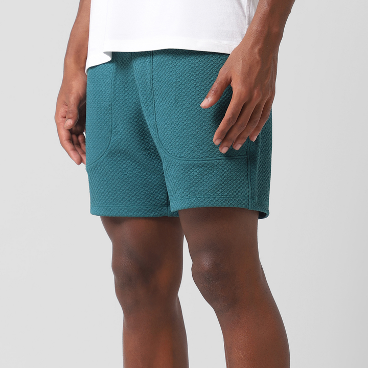 Roam Short 5.5" Dark Teal left side on model