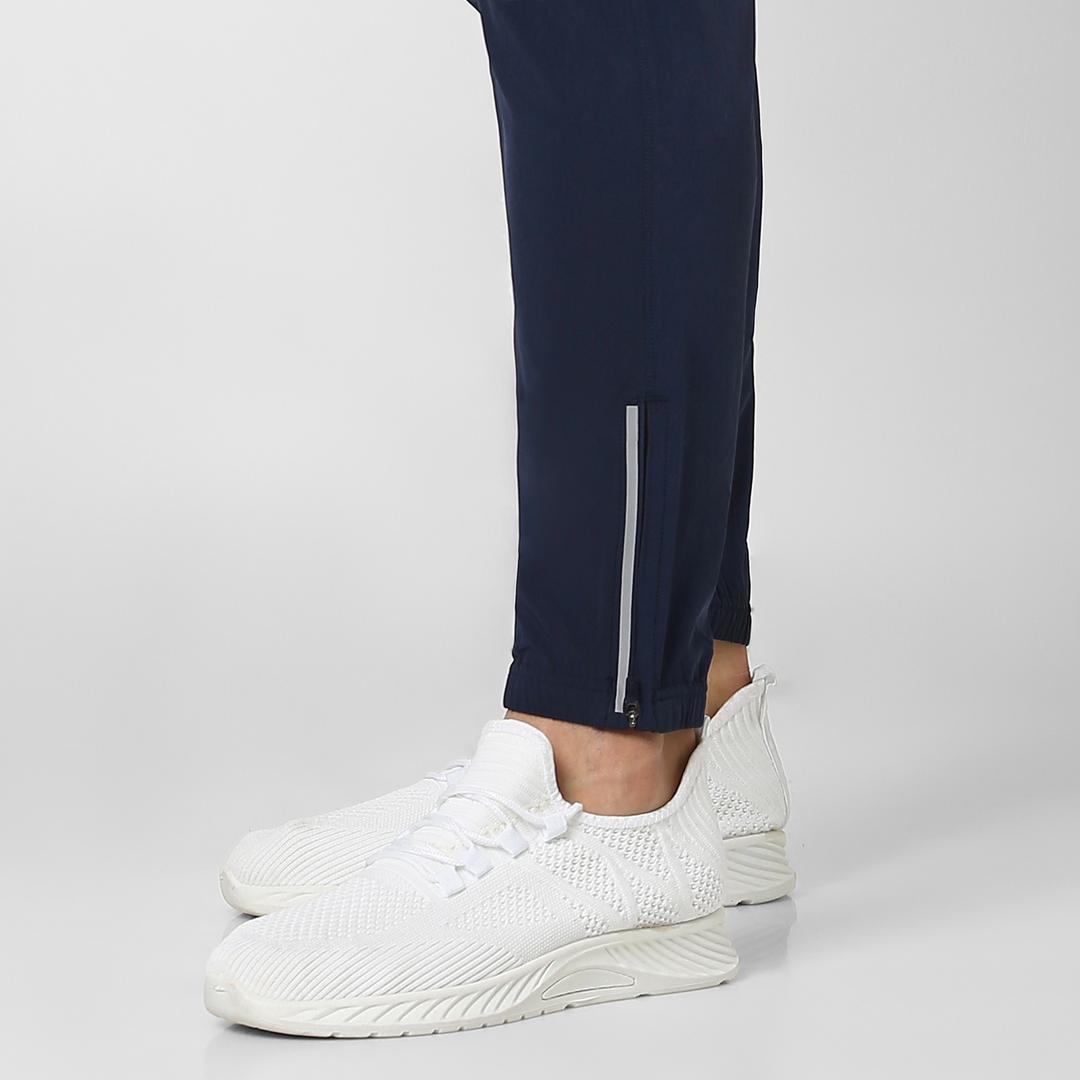 Run Jogger Navy close up zipper at ankles, and reflective strip at side seam/bottom hem