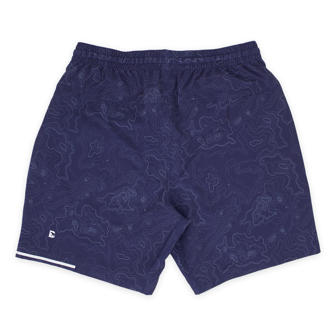 Run Short v2 7" Topo Navy back with elastic waistband, back right hidden zipper pocket, reflective line on bottom left hem, and reflective Bear B logo on bottom left leg