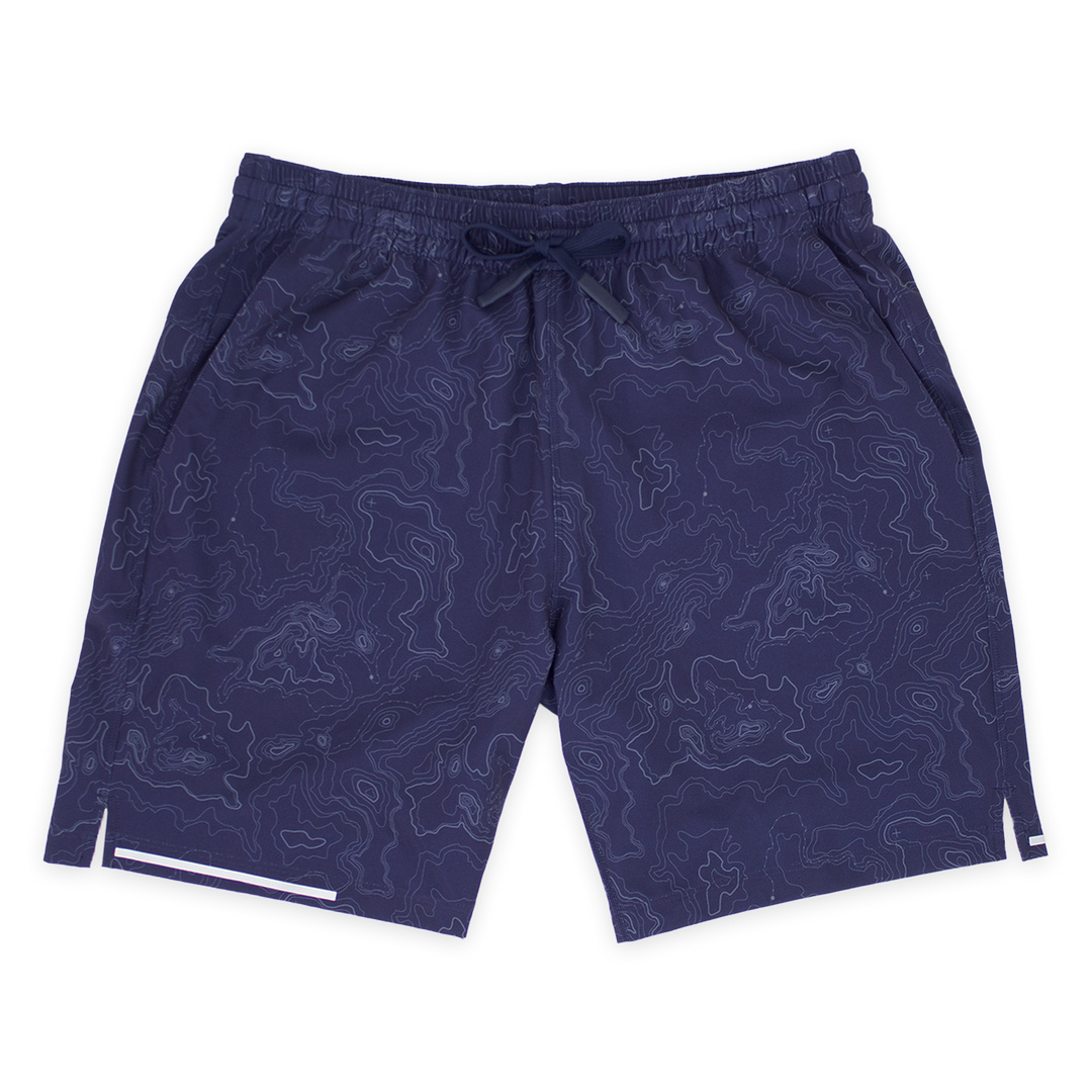 Run Short v2 7" Topo Navy front with elastic waistband, dyed-to-match drawstring with rubberized tips, two front pockets, split hem, and reflective line on bottom right hem
