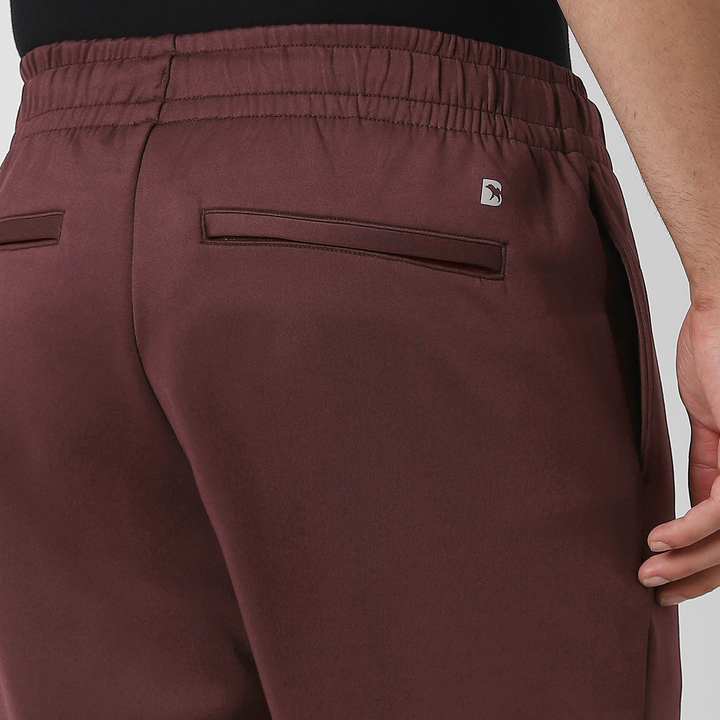 Scuba Jogger Maroon close up back zipper pocket on model