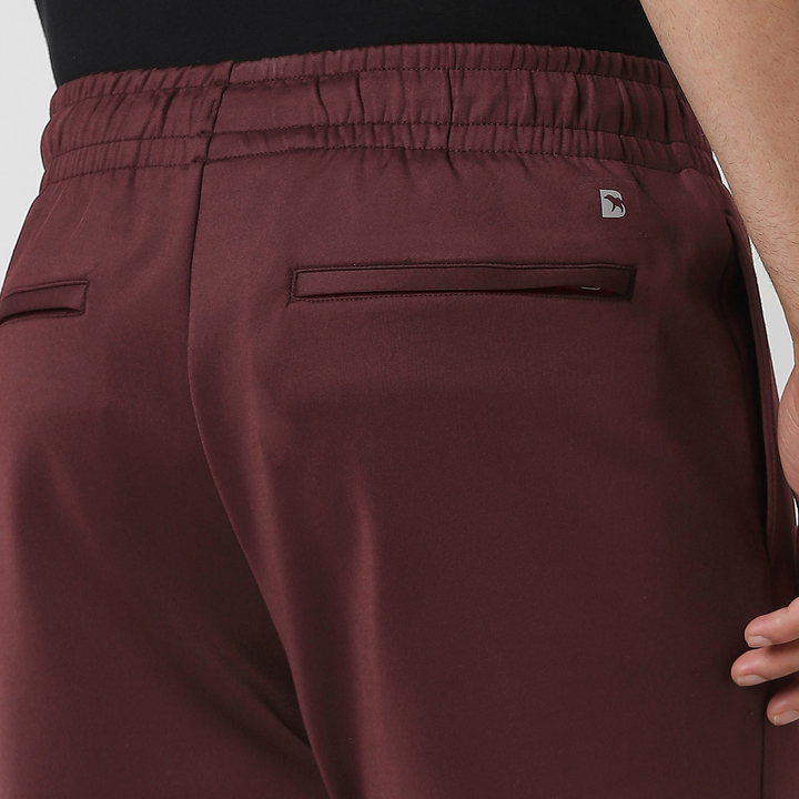 Scuba Short Maroon close up back zipper pockets on model