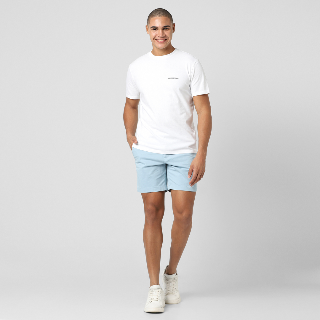 Stretch Short 7" Coastal front on model worn with Natural Dye Logo Tee White