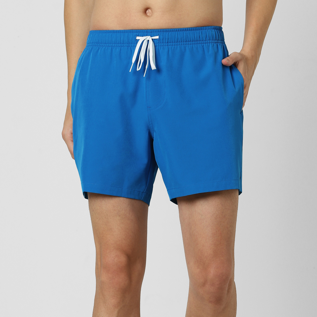 Stretch Swim Solid 5.5" Blue front on model