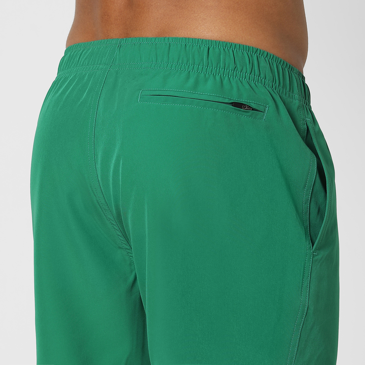 Stretch Swim Solid 5" Jade close up back zipper pocker on model