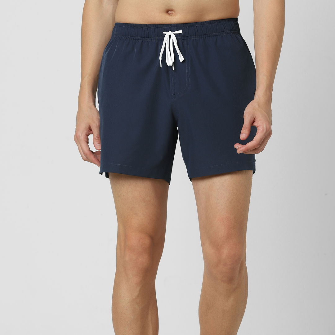 Stretch Swim Solid 5.5" Navy front on model