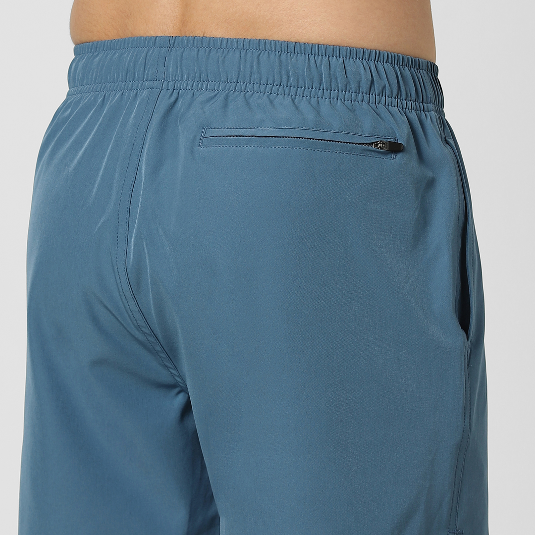 Stretch Swim Solid 5.5" Steel Blue close up back right pocket on model