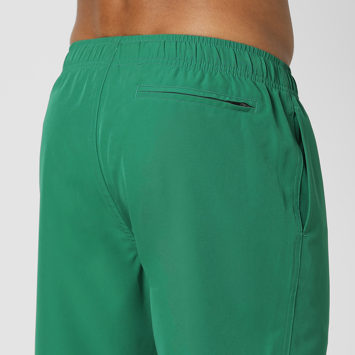 Stretch Swim Solid 7" Jade close up back zipper pocket on model