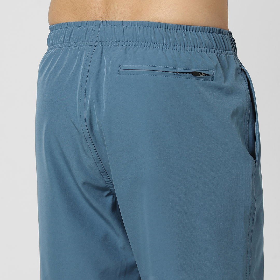 Stretch Swim Solid 7" Steel Blue close up back right pocket on model