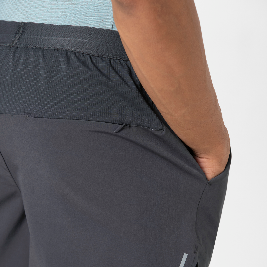 Track Short Lined 4.5" Coal close up back zipper pocket on model