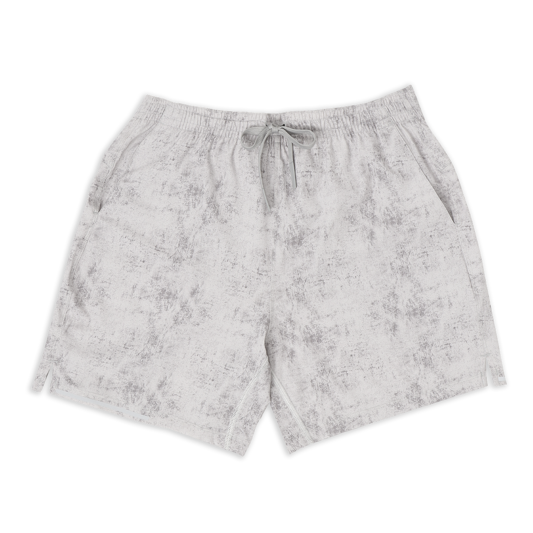 Run Short 5.5" Concrete front with elastic waistband, dyed-to-match drawstring with rubberized tips, two front pockets, split hem, and reflective line on bottom right hem