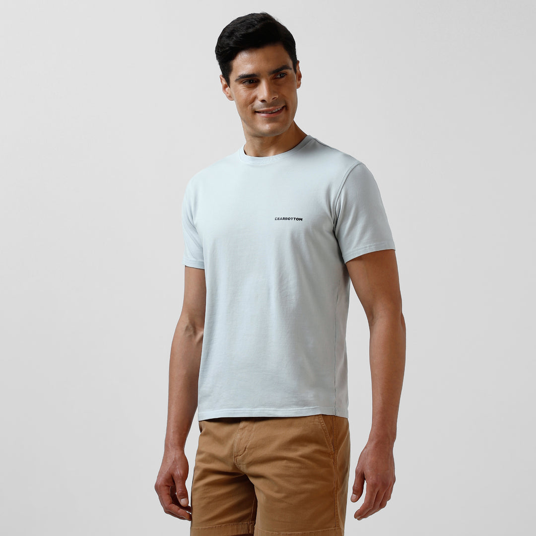 Natural Dye Logo Tee Light Blue side on model