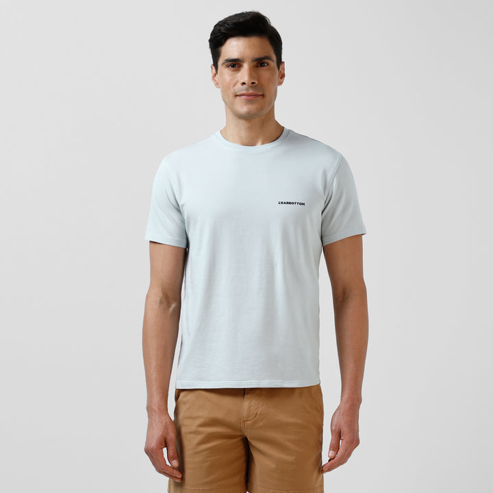 Natural Dye Logo Tee Light Blue front on model